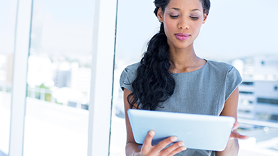A businesswoman working on her tablet