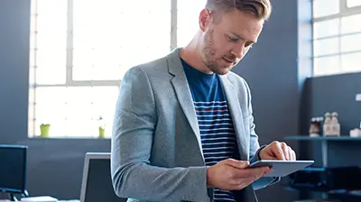 A man working on a tablet