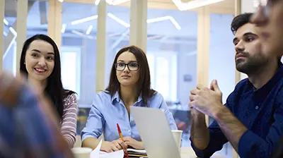 A group of young professionals in a meeting