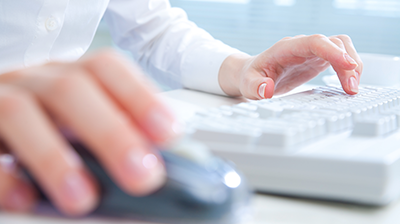 Hands on a keyboard and mouse