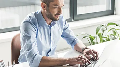 A man working at his laptop
